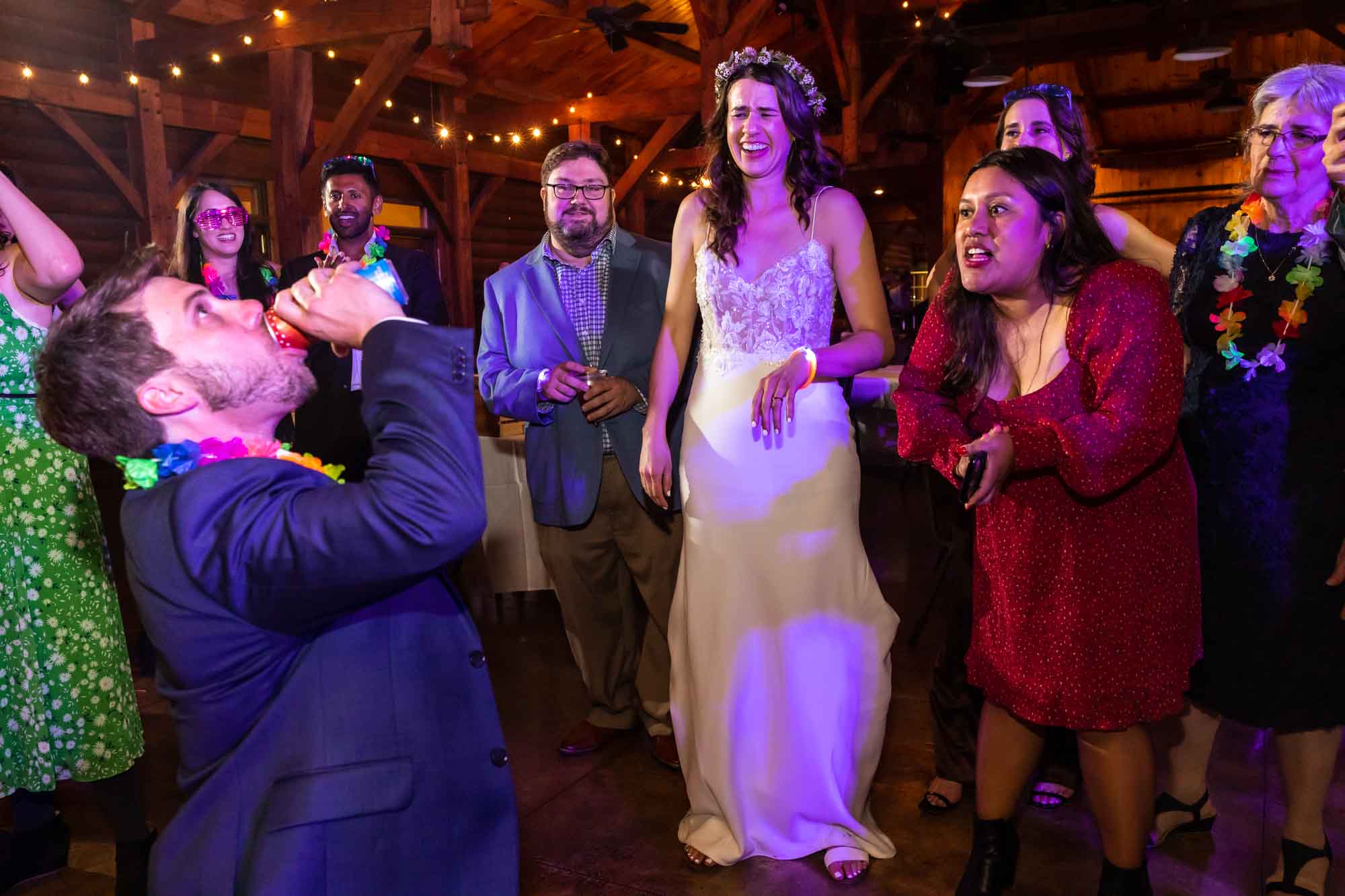 candid wedding reception moments are the focus of a photojournalist who photographs weddings.